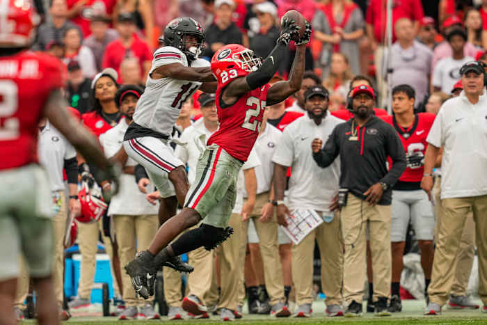 Sep 16, 2023; Athens, Georgia, USA; Georgia Bulldogs defensive back Tykee Smith (23) intercepts a pass in front of South Carolina Gamecocks wide receiver Eddie Lewis (11) during the second half at Sanford Stadium. Mandatory Credit: Dale Zanine-USA TODAY Sports